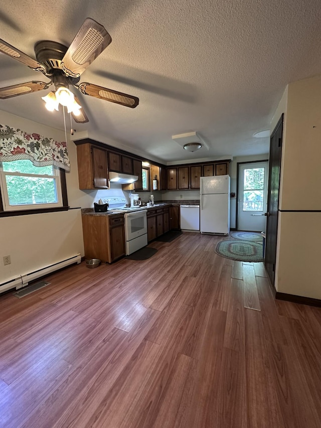 15 Balsam Ln, Naples, ME 04055 - kitchen featuring white appliances, under cabinet range hood, baseboard heating, a textured ceiling, and dark countertops
