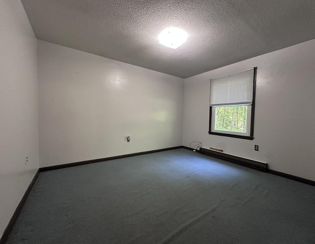 15 Balsam Ln, Naples, ME 04055 - carpeted spare room with a baseboard heating unit, baseboards, and a textured ceiling