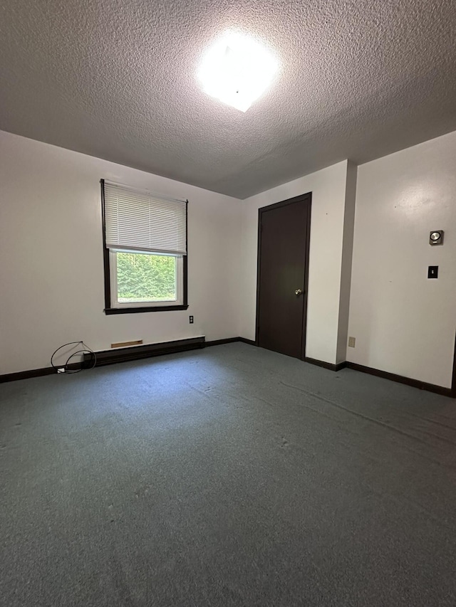 15 Balsam Ln, Naples, ME 04055 - unfurnished room featuring a textured ceiling, baseboards, and carpet floors