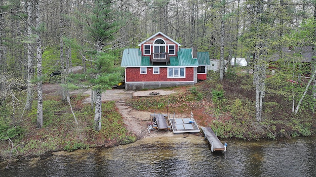 110 Indian Point Dr, Denmark, ME 04022 - back of property with metal roof, a water view, and a view of trees