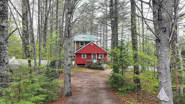 110 Indian Point Dr, Denmark, ME 04022 - rustic home featuring driveway and metal roof