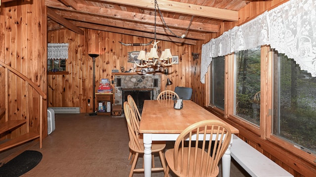 110 Indian Point Dr, Denmark, ME 04022 - dining space with wood walls, baseboard heating, a chandelier, and wooden ceiling with exposed beams