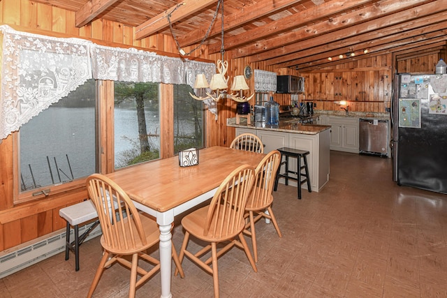 110 Indian Point Dr, Denmark, ME 04022 - dining space featuring wood walls, a chandelier, tile patterned floors, a water view, and wooden ceiling