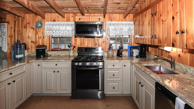 110 Indian Point Dr, Denmark, ME 04022 - kitchen featuring stainless steel appliances, a sink, wood ceiling with exposed beams, wood walls, and light stone countertops