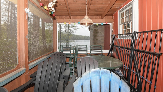 110 Indian Point Dr, Denmark, ME 04022 - sunroom with a water view, outdoor dining space, and beam ceiling