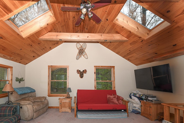 110 Indian Point Dr, Denmark, ME 04022 - carpeted living room featuring a skylight, plenty of natural light, a ceiling fan, wooden ceiling, and baseboards