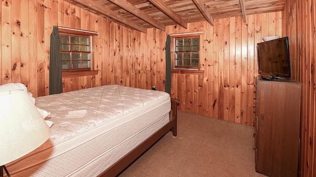 110 Indian Point Dr, Denmark, ME 04022 - bedroom featuring wood ceiling with exposed beams, tile patterned floors, and wooden walls