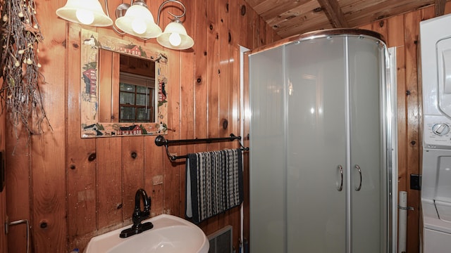 110 Indian Point Dr, Denmark, ME 04022 - bathroom featuring wood walls, a stall shower, wooden ceiling, and a sink