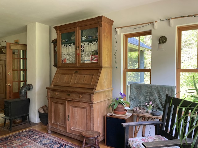12 Bakers Pt, Steuben, ME 04680 - living area with a wood stove and wood finished floors