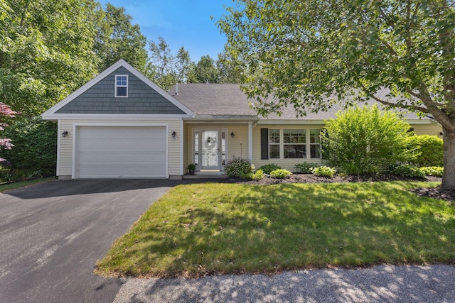 8 Kavanaugh Rd Unit 8, Old Orchard Beach, ME 04064 - view of front of house featuring driveway, a garage, and a front lawn
