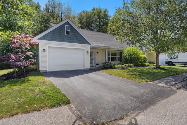8 Kavanaugh Rd Unit 8, Old Orchard Beach, ME 04064 - view of front facade featuring driveway, a garage, and a front yard