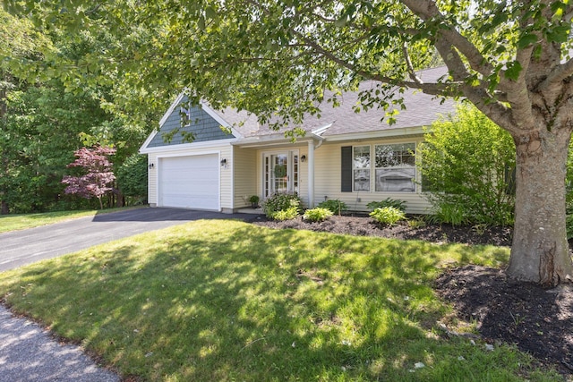 8 Kavanaugh Rd Unit 8, Old Orchard Beach, ME 04064 - view of front of home featuring driveway, an attached garage, a front yard, and roof with shingles
