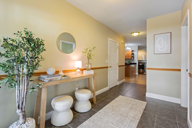 8 Kavanaugh Rd Unit 8, Old Orchard Beach, ME 04064 - hall with dark tile patterned flooring and baseboards