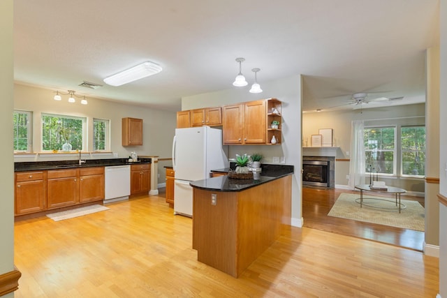 8 Kavanaugh Rd Unit 8, Old Orchard Beach, ME 04064 - kitchen with white appliances, light wood-style floors, a peninsula, open shelves, and brown cabinetry