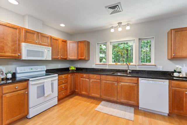 8 Kavanaugh Rd Unit 8, Old Orchard Beach, ME 04064 - kitchen featuring white appliances, light wood-type flooring, recessed lighting, and brown cabinets