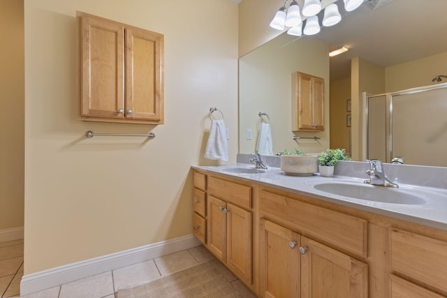 8 Kavanaugh Rd Unit 8, Old Orchard Beach, ME 04064 - bathroom with tile patterned flooring, double vanity, a stall shower, and a chandelier