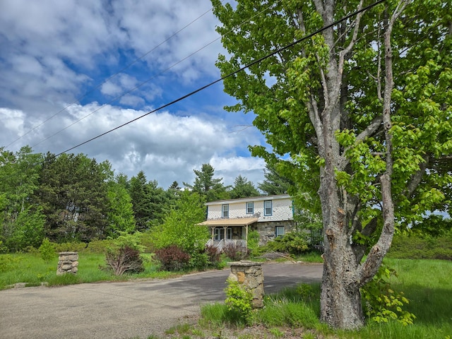291 Pea Ridge Rd, Chester, ME 04457 - view of front of home featuring driveway and stone siding