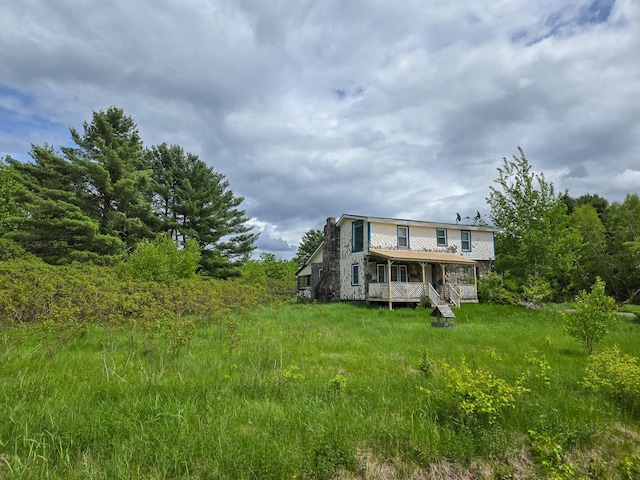 291 Pea Ridge Rd, Chester, ME 04457 - rear view of house with a porch