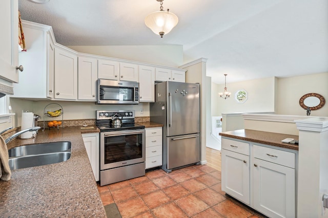 30 Date St, Old Orchard Beach, ME 04064 - kitchen with appliances with stainless steel finishes, a sink, lofted ceiling, white cabinets, and dark countertops