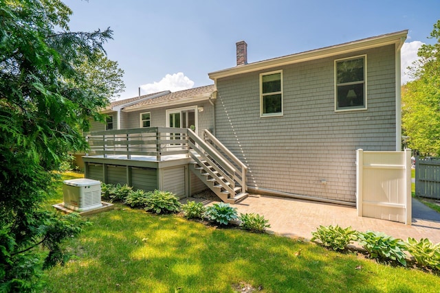 30 Date St, Old Orchard Beach, ME 04064 - back of property featuring a chimney, a deck, and stairway