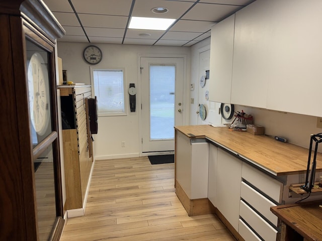 30 Date St, Old Orchard Beach, ME 04064 - kitchen with butcher block counters, light wood finished floors, white cabinets, and a drop ceiling