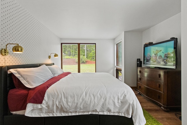 2 Flynn Rd, Raymond, ME 04071 - bedroom featuring wallpapered walls, wood finished floors, access to outside, and an accent wall