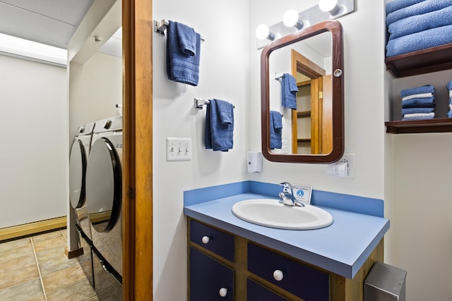 2 Flynn Rd, Raymond, ME 04071 - bathroom with washing machine and dryer, vanity, and a baseboard radiator