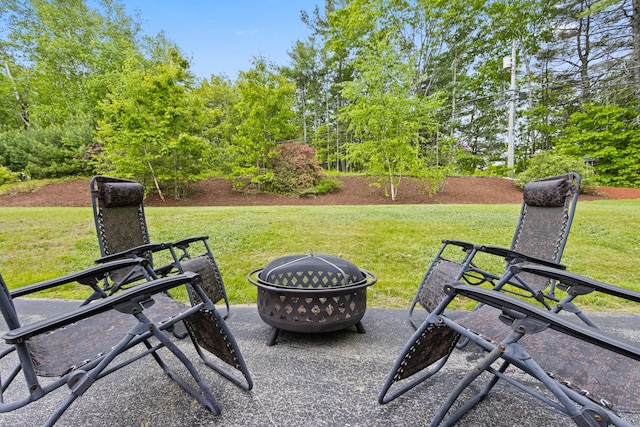 2 Flynn Rd, Raymond, ME 04071 - view of patio / terrace featuring a fire pit and view of wooded area