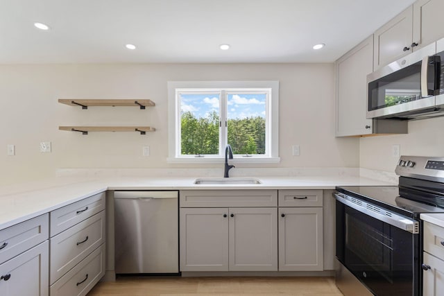 142 Hacker Rd, Brunswick, ME 04011 - kitchen with appliances with stainless steel finishes, open shelves, gray cabinets, light countertops, and recessed lighting