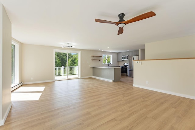 142 Hacker Rd, Brunswick, ME 04011 - unfurnished living room featuring baseboard heating, light wood-style floors, a ceiling fan, and recessed lighting