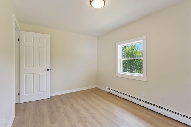 142 Hacker Rd, Brunswick, ME 04011 - spare room featuring a baseboard radiator and light wood finished floors