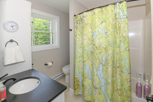 7 Elysian Way, Bridgton, ME 04009 - full bath featuring baseboard heating, vanity, shower / bathtub combination with curtain, and toilet