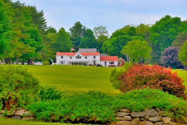 7 Elysian Way, Bridgton, ME 04009 - rear view of house with a lawn
