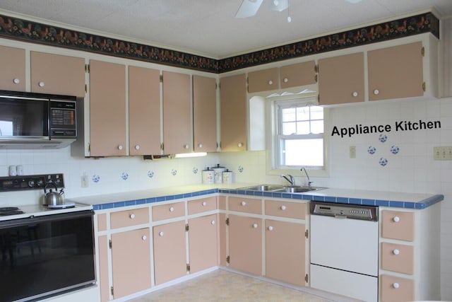 225 Webber Ave, Lewiston, ME 04240 - kitchen with white dishwasher, electric range oven, tasteful backsplash, and ceiling fan