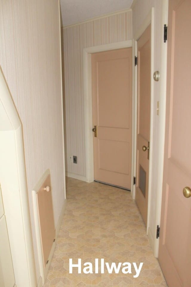 225 Webber Ave, Lewiston, ME 04240 - hallway featuring wallpapered walls and baseboards