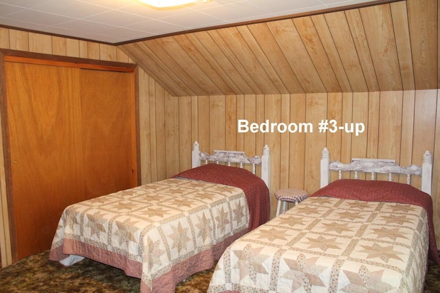 225 Webber Ave, Lewiston, ME 04240 - carpeted bedroom featuring wooden walls and lofted ceiling