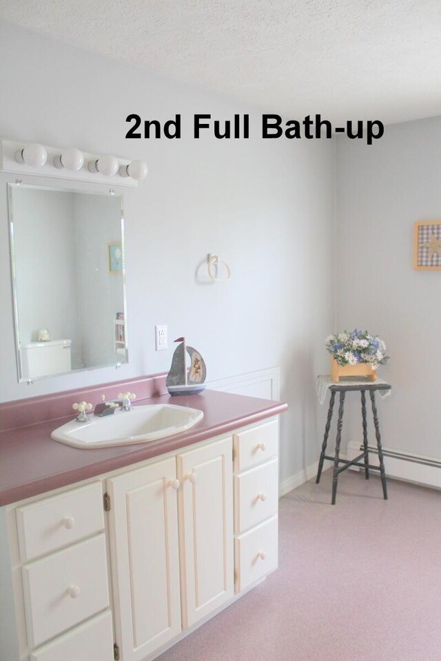 225 Webber Ave, Lewiston, ME 04240 - bathroom featuring vanity and a textured ceiling