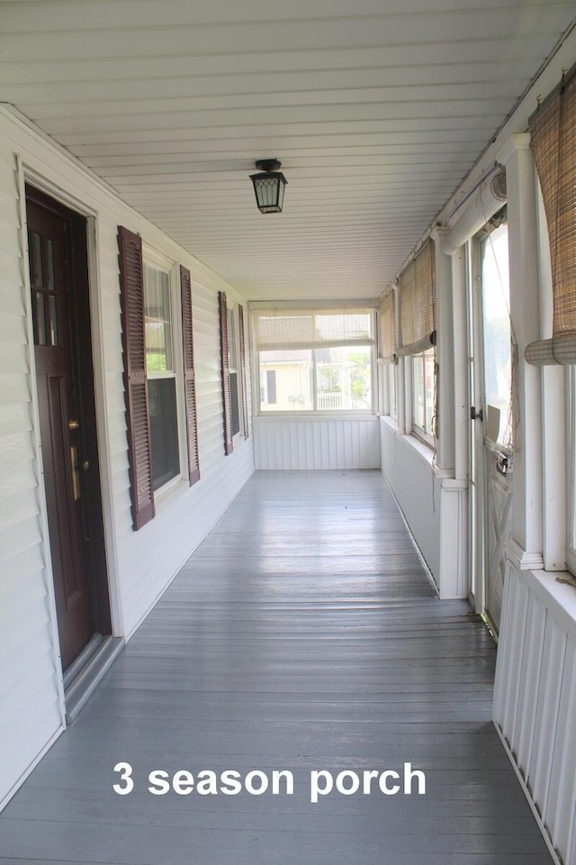 225 Webber Ave, Lewiston, ME 04240 - unfurnished sunroom featuring wood finished floors