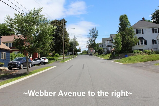 225 Webber Ave, Lewiston, ME 04240 - view of asphalt road with street lighting, a residential view, and sidewalks