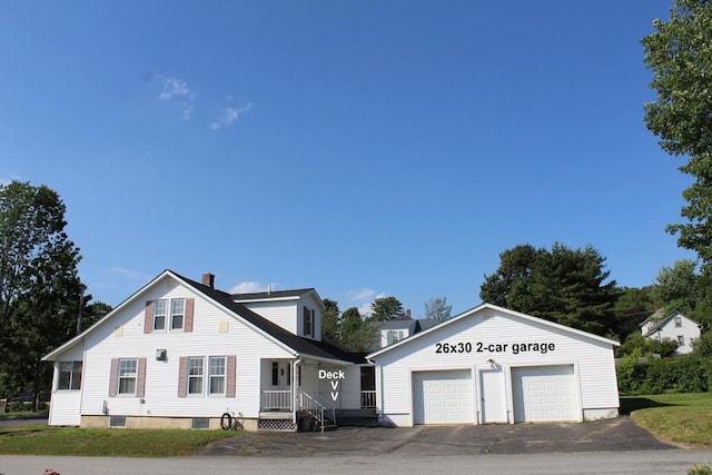 225 Webber Ave, Lewiston, ME 04240 - view of front of property featuring an outbuilding, a garage, and a chimney