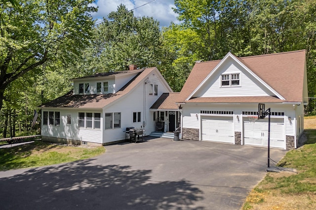 71 Blake Rd, Turner, ME 04282 - traditional home with driveway, a garage, stone siding, and roof with shingles