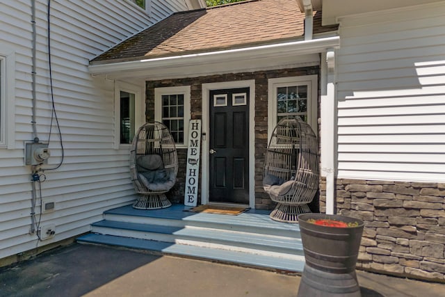 71 Blake Rd, Turner, ME 04282 - entrance to property featuring roof with shingles and a porch