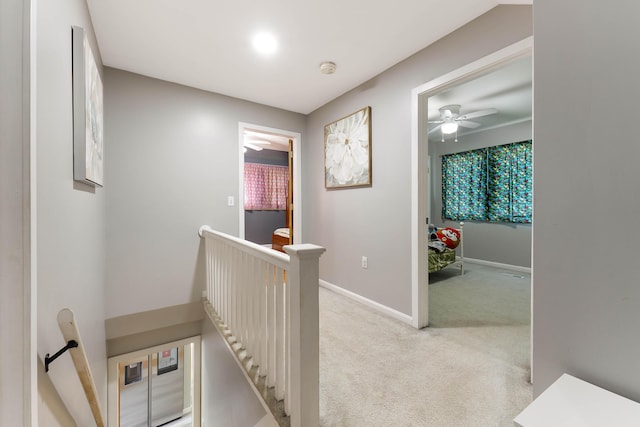 71 Blake Rd, Turner, ME 04282 - corridor featuring an upstairs landing, light carpet, and baseboards
