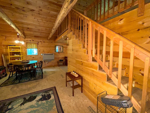 71 Wilderness Way, Burlington, ME 04417 - dining area with heating unit, stairway, wood walls, and wooden ceiling