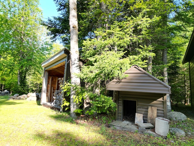 168 W Tucker Ridge Rd, Springfield, ME 04487 - view of front facade featuring an outbuilding and a front yard