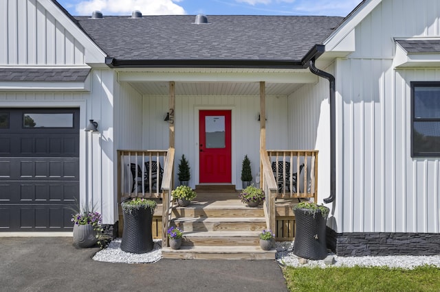 25 Royale Dr, Sidney, ME 04330 - entrance to property with a shingled roof, covered porch, and a garage