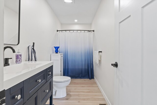 25 Royale Dr, Sidney, ME 04330 - full bath with wood finished floors, vanity, toilet, curtained shower, and recessed lighting