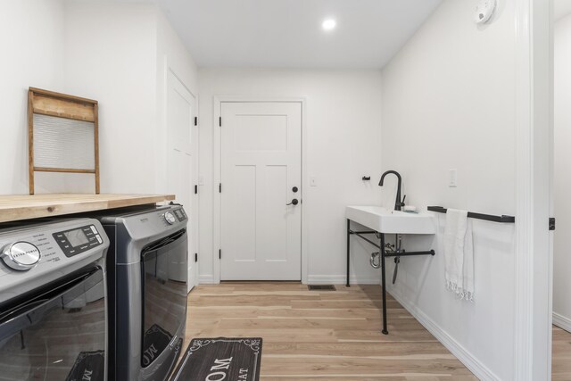 25 Royale Dr, Sidney, ME 04330 - washroom featuring washer and dryer, light wood finished floors, baseboards, and recessed lighting