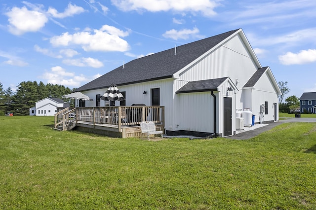 25 Royale Dr, Sidney, ME 04330 - back of house featuring a shingled roof, a deck, and a yard
