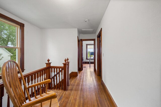 110 Depot St, Unity, ME 04988 - hallway featuring an upstairs landing, healthy amount of natural light, hardwood / wood-style floors, and attic access